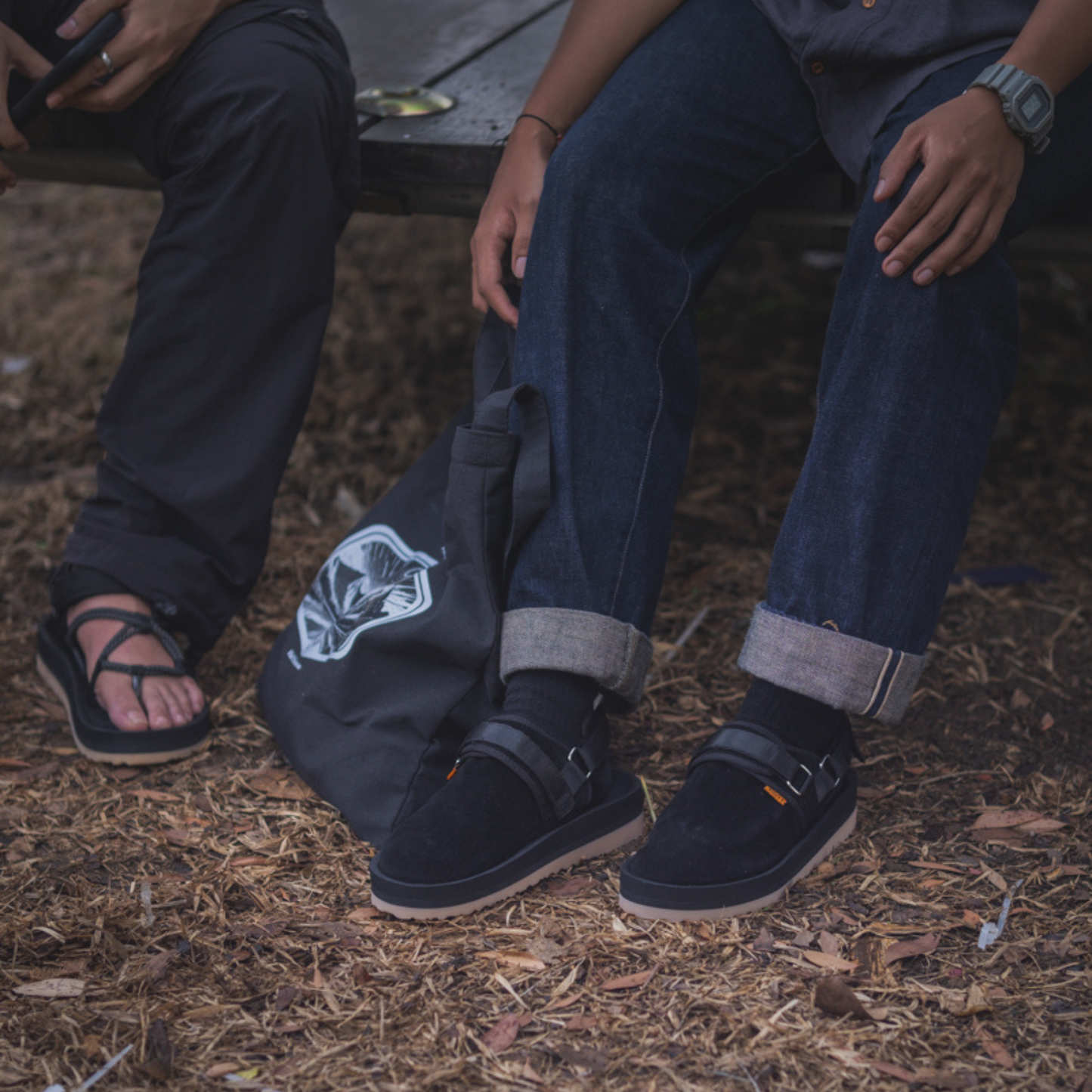 Person wearing Graklu Phantom Suede Lifestyle Mule Sandals with denim jeans, showcasing its casual style and perfect fit for leisurely outings.