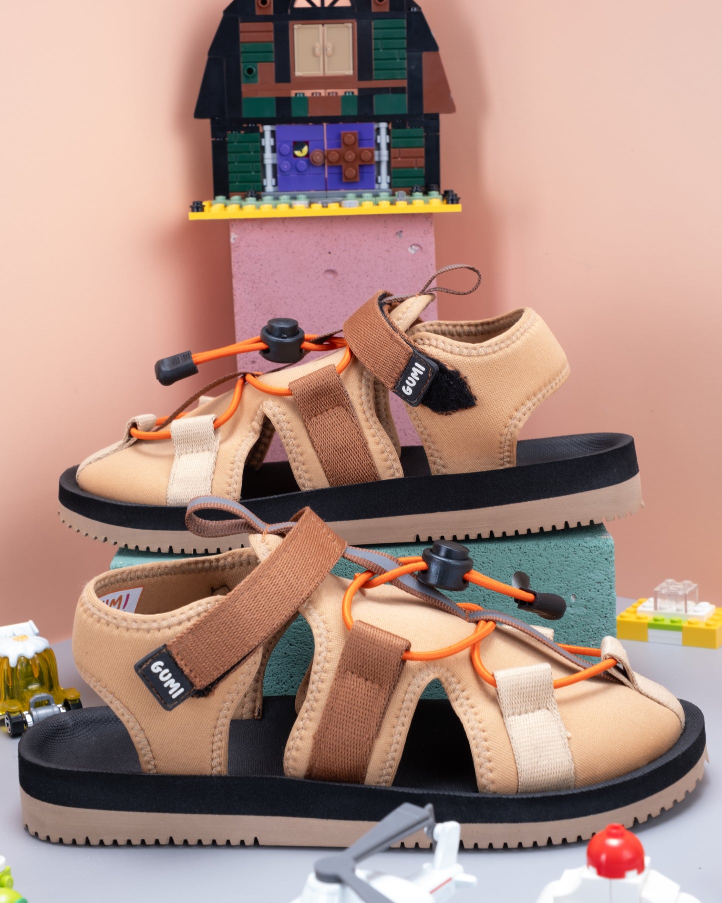 HYDE Sunlit Mars - Hybrid Sandals for Kids captured in an attractive setup with colourful toys to highlight fun and creativity.