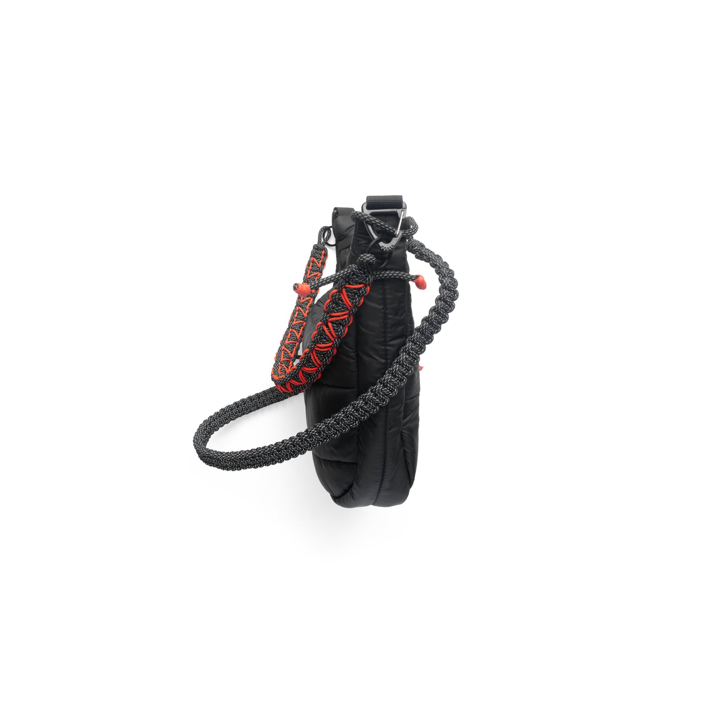 Side view of the QUITAN Abyss Padded Crossbody Bag showcasing its unique padded design and adjustable strap.