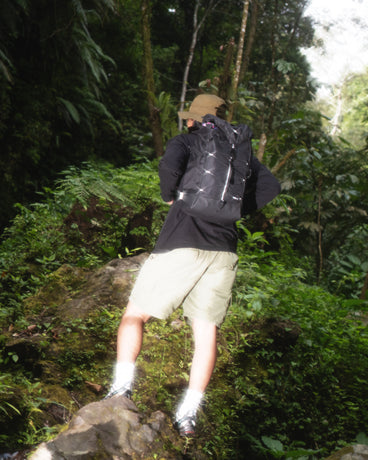 TREQ SHADOW Trail 22L Outdoor Backpack with a close-up of the top, featuring the buckle closure and rugged texture.